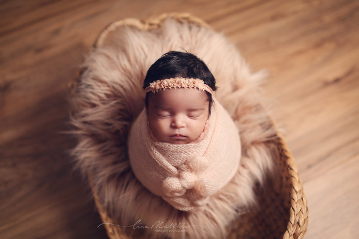 long, two tone, faux sheepskin fur photo prop with baby girl