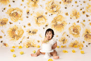 young girl, birthday cake smash with yellow flower backdrop by custom photo props