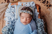 blue newborn baby girl sleeping in blue mohair wrap