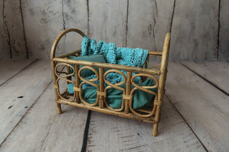 newborn baby bamboo crib photography prop with small blue blanket and wrap