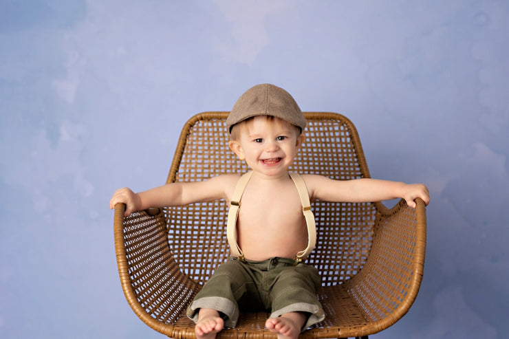 little boy with blue photo water color backdrop by custom photo props