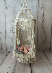 woven, fringe, macrame, natural toned newborn baby girl hanging hammock with part for baby to lay during photos. use outdoor