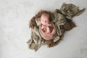 textured brown faux fur with custom photo props flokati fur with baby boy in bowl and layering fabrics