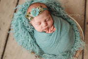 light turquoise or aqua blue swaddling wrap on baby girl newborn pictures