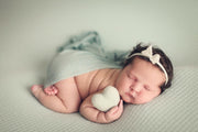 newborn felted heart with baby girl on belly for photography props