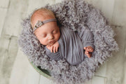 dusty purple newborn baby faux fur photography prop of baby girl in bowl