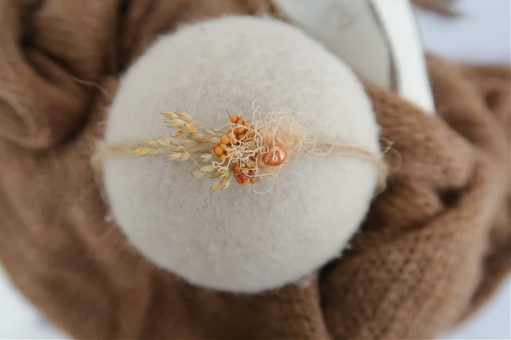 tiny orange and dried flowers headband for premie baby photos. preemie baby headband photography prop