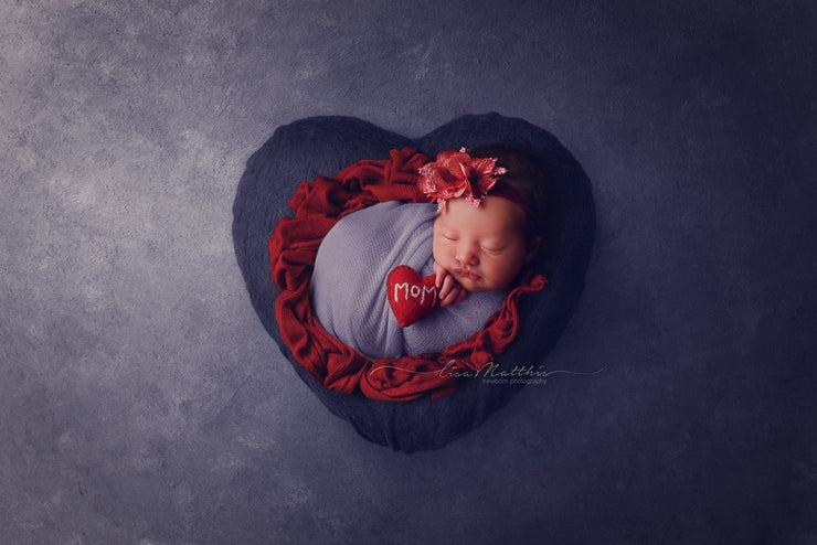 newborn girl with felted heart with mom written on it by custom photo props