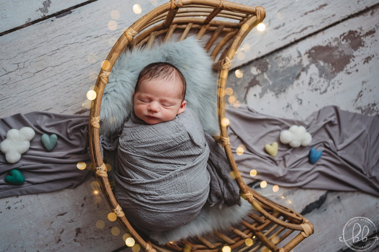 baby boy in cane or bamboo moon prop by custom photo props