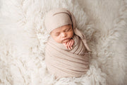 neutral fuzzy stretch swaddling wrap for newborn baby with matching hat